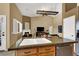 Open concept kitchen with granite countertops, stainless steel appliances, and a kitchen island at 10805 Hollow Creek Ln, Las Vegas, NV 89144