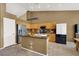 Beautiful kitchen featuring light wood cabinets, stainless steel appliances, and a kitchen island at 10805 Hollow Creek Ln, Las Vegas, NV 89144