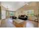 Open living room featuring vaulted ceilings, ample natural light, and cozy seating at 10805 Hollow Creek Ln, Las Vegas, NV 89144