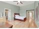 Spacious main bedroom featuring vaulted ceilings, a walk in closet, and light wood floors at 10805 Hollow Creek Ln, Las Vegas, NV 89144