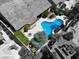 Birds eye view of a private backyard pool with a modern design, firepit, and outdoor seating at 10805 Hollow Creek Ln, Las Vegas, NV 89144