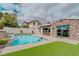 The refreshing backyard pool is surrounded by a stone patio, great for entertaining at 11477 Timber Mountain Ave, Las Vegas, NV 89135