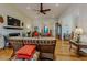 Well-appointed living room featuring hardwood floors, a fireplace, and stylish decor at 11477 Timber Mountain Ave, Las Vegas, NV 89135