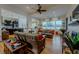 Spacious living room features hardwood floors, neutral paint, lots of natural light and comfortable furniture at 11477 Timber Mountain Ave, Las Vegas, NV 89135