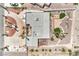 Aerial view showcasing the desert home's gray roof, unique landscaping and circular driveway at 1157 Morning Sun Way, Las Vegas, NV 89110