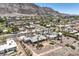 Aerial view of a desert landscaped home with palm trees and artificial turf at 1157 Morning Sun Way, Las Vegas, NV 89110