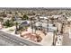 Aerial view of a desert landscaped house with mature palm trees and a circular driveway at 1157 Morning Sun Way, Las Vegas, NV 89110