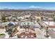 Aerial view of a desert landscaped house featuring mature palm trees and desert landscaping at 1157 Morning Sun Way, Las Vegas, NV 89110