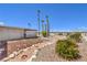 Desert landscaped backyard featuring colorful plants and small rock walkway and beautiful panoramic views at 1157 Morning Sun Way, Las Vegas, NV 89110