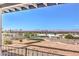 Enjoy panoramic city views from the backyard, featuring desert landscaping and iron railing at 1157 Morning Sun Way, Las Vegas, NV 89110