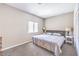 Neutral bedroom with soft carpet and furnishings, natural light from a window at 1157 Morning Sun Way, Las Vegas, NV 89110