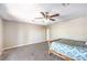 Large bedroom with neutral colored carpet and ceiling fan at 1157 Morning Sun Way, Las Vegas, NV 89110