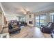 Cozy living room with hardwood floors, a fireplace, and sliding glass doors with city views at 1157 Morning Sun Way, Las Vegas, NV 89110