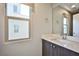 Bright bathroom with a single sink vanity and modern fixtures at 1275 Ice Park St # 101, Las Vegas, NV 89135