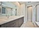 Bathroom with double sink vanity and glass enclosed shower at 1275 Ice Park St # 101, Las Vegas, NV 89135