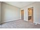 Expansive bedroom with entrances to the bathroom and closet at 1275 Ice Park St # 101, Las Vegas, NV 89135