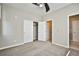 Bedroom featuring a ceiling fan and access to an ensuite bathroom and walk-in closet at 1275 Ice Park St # 101, Las Vegas, NV 89135