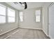 Bedroom with neutral walls, carpet, fan and multiple windows that let in ample light at 1275 Ice Park St # 101, Las Vegas, NV 89135