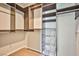 Spacious walk-in closet with custom shelving and metal basket drawers at 1275 Ice Park St # 101, Las Vegas, NV 89135