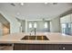 Bright, open kitchen with large island and stainless steel sink at 1275 Ice Park St # 101, Las Vegas, NV 89135