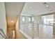 Open concept living area with modern railings, lots of windows, and neutral paint at 1275 Ice Park St # 101, Las Vegas, NV 89135