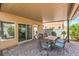 Covered patio extends the living space outdoors, offering shade and a dining area next to home at 1420 Gilbert Creek Ave, North Las Vegas, NV 89031