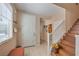 Foyer with tiled floors, stairs to second level, and an entrance to the rest of the home at 1420 Gilbert Creek Ave, North Las Vegas, NV 89031