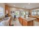 Kitchen with stainless steel appliances, granite countertops, and breakfast bar overlooking the dining area at 1420 Gilbert Creek Ave, North Las Vegas, NV 89031
