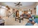 Open living room with stairs, light-colored walls, tiled floors, and decorative furniture at 1420 Gilbert Creek Ave, North Las Vegas, NV 89031