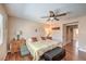 The main bedroom features wood-look floors, neutral walls, and classic furnishings at 1420 Gilbert Creek Ave, North Las Vegas, NV 89031