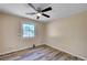 Bedroom featuring hardwood floors and view of neighborhood at 1560 Arabian Dr, Henderson, NV 89002
