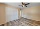 Bedroom features hardwood floors, ceiling fan and double door closet at 1560 Arabian Dr, Henderson, NV 89002