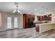 Open concept kitchen features custom cabinets, updated appliances, and granite countertops at 1560 Arabian Dr, Henderson, NV 89002