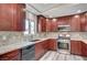 Updated kitchen features wood cabinets, stainless appliances and granite countertops at 1560 Arabian Dr, Henderson, NV 89002