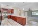 Modern kitchen featuring stainless steel appliances, granite countertops, and wood cabinets at 1560 Arabian Dr, Henderson, NV 89002