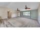 Bright living room features fresh paint, new carpet, and an abundance of natural light at 1560 Arabian Dr, Henderson, NV 89002