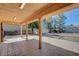 Covered patio featuring tiled flooring and view of large backyard at 1560 Arabian Dr, Henderson, NV 89002