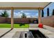 Backyard featuring a covered patio with outdoor seating, barbecue, and low-maintenance landscaping at 1637 Harvest Pecan Ct, Las Vegas, NV 89108