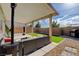 Backyard with covered patio, outdoor seating area, barbecue and low maintenance landscaping at 1637 Harvest Pecan Ct, Las Vegas, NV 89108