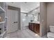 This bathroom includes a double sink vanity, toilet, and shower with tub at 1637 Harvest Pecan Ct, Las Vegas, NV 89108