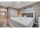 This cozy bedroom features a comfortable bed and access to a closet and hallway at 1637 Harvest Pecan Ct, Las Vegas, NV 89108