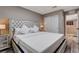 The spacious bedroom features a comfortable bed, closet and exterior door at 1637 Harvest Pecan Ct, Las Vegas, NV 89108