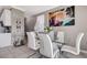 Bright dining area with a glass table, modern chairs, and elegant decor at 1637 Harvest Pecan Ct, Las Vegas, NV 89108