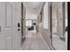Bright entryway with tiled floors, mirror, and view into the living area at 1637 Harvest Pecan Ct, Las Vegas, NV 89108