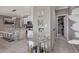 Open-concept kitchen and bar seating area with modern appliances and stylish decor at 1637 Harvest Pecan Ct, Las Vegas, NV 89108