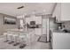 Modern kitchen featuring granite countertops, white cabinets, and stainless steel appliances at 1637 Harvest Pecan Ct, Las Vegas, NV 89108