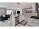 Open living space with granite island, modern appliances, and access to the cozy living room at 1637 Harvest Pecan Ct, Las Vegas, NV 89108