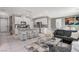 Open-concept kitchen and living area with modern decor and white countertops at 1637 Harvest Pecan Ct, Las Vegas, NV 89108