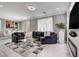 Comfortable living room with modern decor and a view to the backyard at 1637 Harvest Pecan Ct, Las Vegas, NV 89108