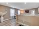 A loft with neutral walls and hardwood flooring features a decorative table and mirrors at 1637 Harvest Pecan Ct, Las Vegas, NV 89108